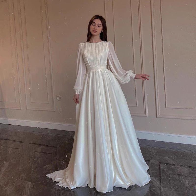 Women's White Chiffon Pleated Maxi Dress with Sheer Blouson Sleeves - Maisie London