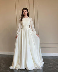 Women's White Chiffon Pleated Maxi Dress with Sheer Blouson Sleeves - Maisie London