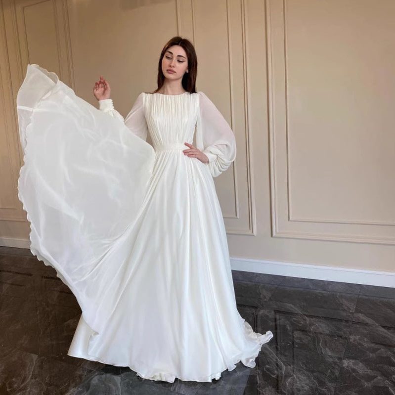 Women's White Chiffon Pleated Maxi Dress with Sheer Blouson Sleeves - Maisie London